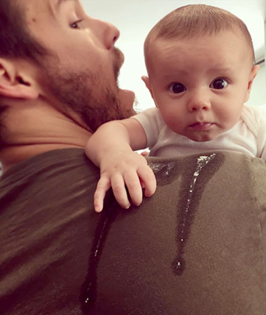 Dr. Faye's son Scott holding his baby son Ford at his shoulder